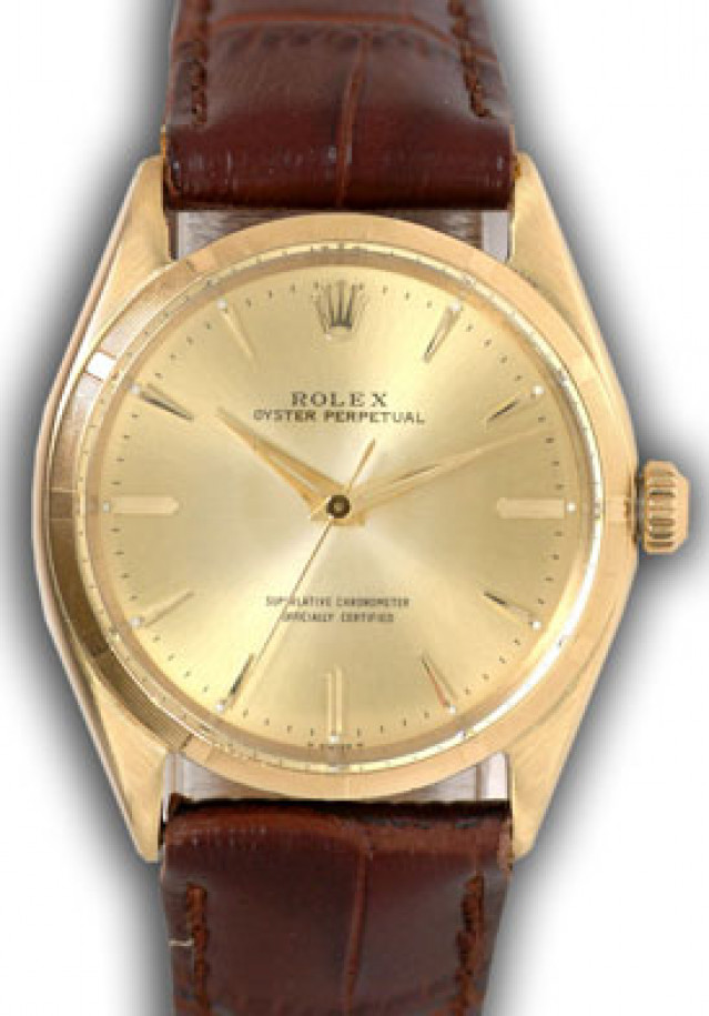 Rolex 1005 Yellow Gold on Strap, Engine Turned Bezel Champagne with Gold Index